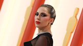 Makeup-Free Lady Gaga Delivers Emotional Performance of ‘Top Gun: Maverick’ Theme Song ‘Hold My Hand’ During Surprise Oscars 2023...