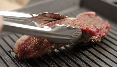 Why You Should Only Use Tongs To Flip Your Steaks