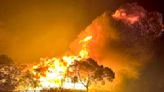 Dozens evacuate and 10 homes are destroyed by a wildfire burning out of control on the edge of Perth