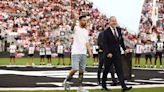 Injured Lionel Messi hobbles onto field to celebrate Copa America win