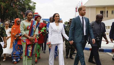 Meghan Markle Nails Business Chic in an All-White Suit on Her Nigerian Tour