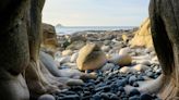 The secluded beach with 'dinosaur egg' boulders and historic submarine wreck