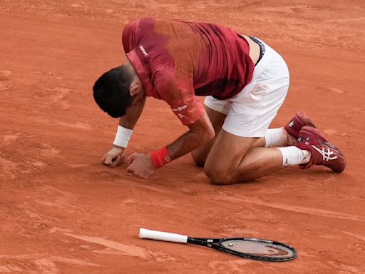 Novak Djokovic's French Open title defense and stay at No. 1 end because of an injured knee