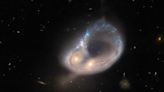 Hubble spots colliding galaxies in a spectacular dance