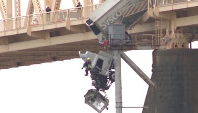 Dramatic video shows harrowing moment truck crashes on bridge in Louisville, Kentucky, left dangling off edge