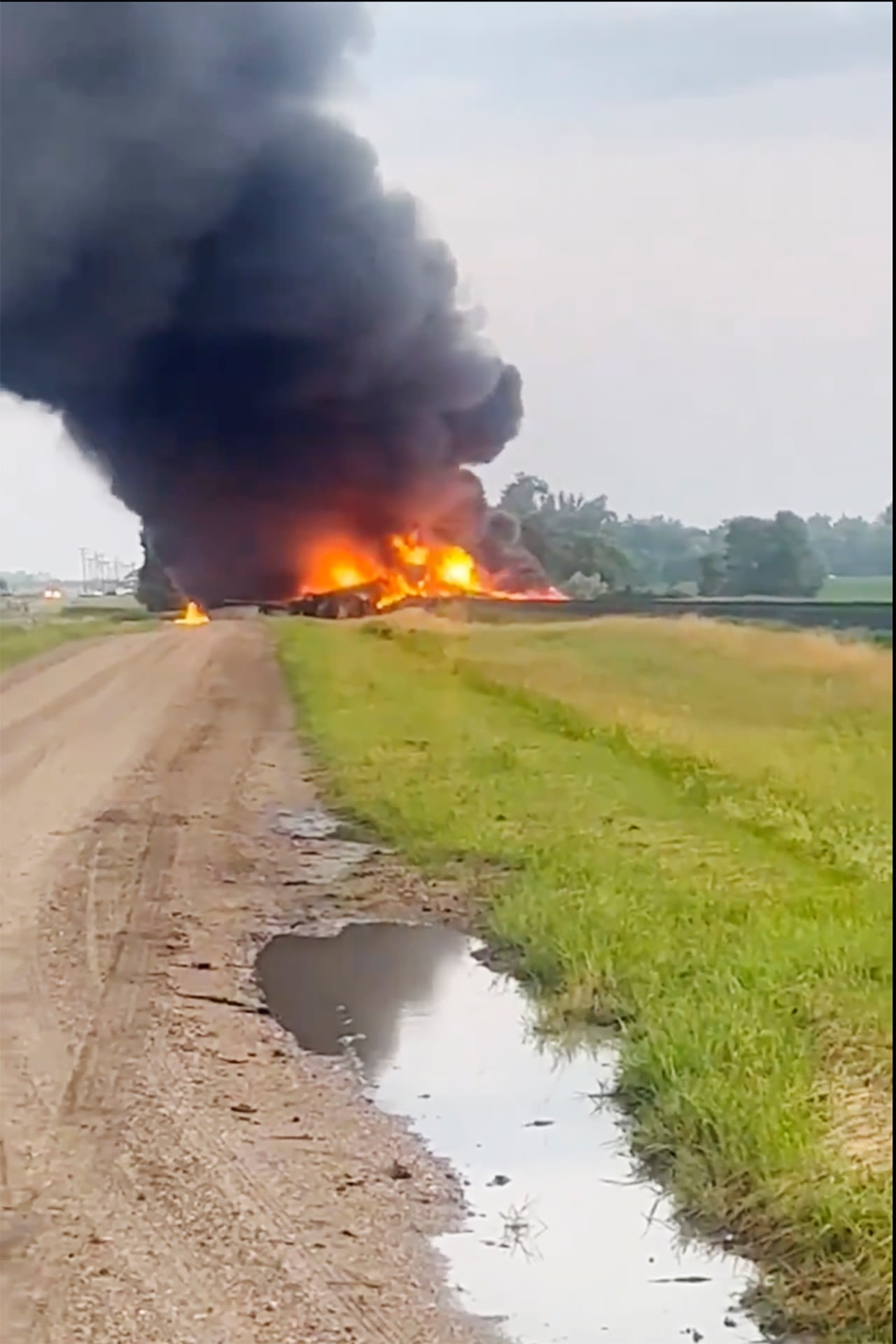 Rail cars carrying hazardous material derail and catch fire in North Dakota