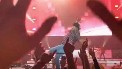 Luke Bryan Slips on Vancouver Fan's Phone, Falls on Stage