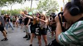 'Not for sale': Why are people squirting water on tourists in Barcelona