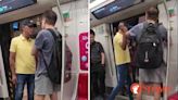 Man on train verbally abuses commuter, who just stands there and says nothing