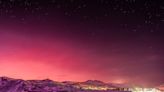 Amazing photo shows Antarctica bathed in pink light after a volcano eruption spewed particles in the atmosphere