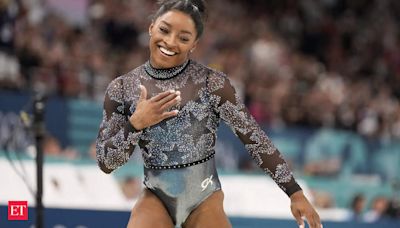 Simone Biles shakes off a calf injury to dominate during Olympic gymnastics qualifying - The Economic Times