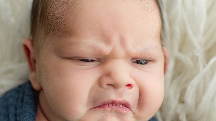 Photoshoot of grumpy baby goes viral, has the internet cooing: 'He's like seriously?'