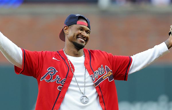 Usher did a little shimmy as he tossed the first pitch at a Braves game: See the video