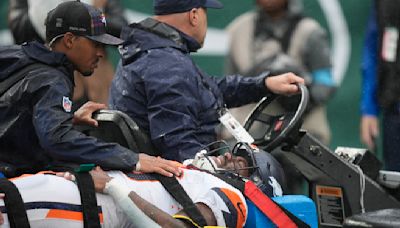 Broncos RB Tyler Badie stabilized on stretcher after collapsing on sideline with back injury