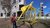 A wooden elephant and two giraffes appeared on the Somerville Community Path. Meet the guy who put them there. - The Boston Globe