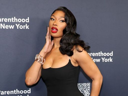 Megan Thee Stallion keeps the snake theme going by shedding her skin in lusty photos