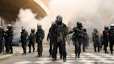 Paris rocked by RIOTS as cops charge protesters with batons before Olympics