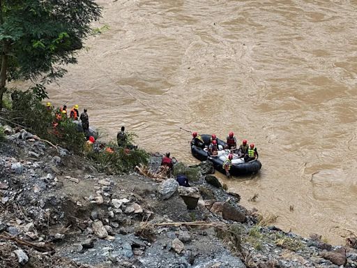 Search for dozens missing after landslide sweeps buses into Nepal river is suspended - The Economic Times