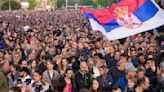 Thousands march in silence in Serbia after mass shootings