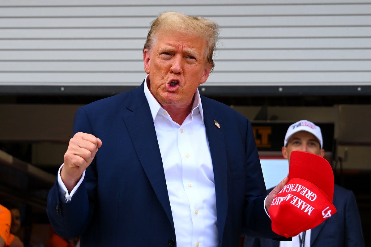 Donald Trump waves to crowd and visits McLaren garage at F1 Miami Grand Prix