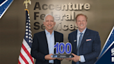 John Goodman of Accenture Federal Services Accepts 2024 Wash100 Award From Jim Garrettson of Executive Mosaic