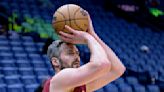 Love picks Miami; AP source says Heat also to sign Zeller