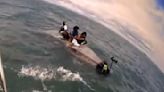 Macomb County deputies rescue 4 people clinging to overturned boat in middle of lake