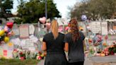 The Parkland shooting is being reenacted as part of a civil lawsuit. One survivor's mother who could hear the 'eerie' gunshots from her home says she hopes it'll force school resource officers to get more training.