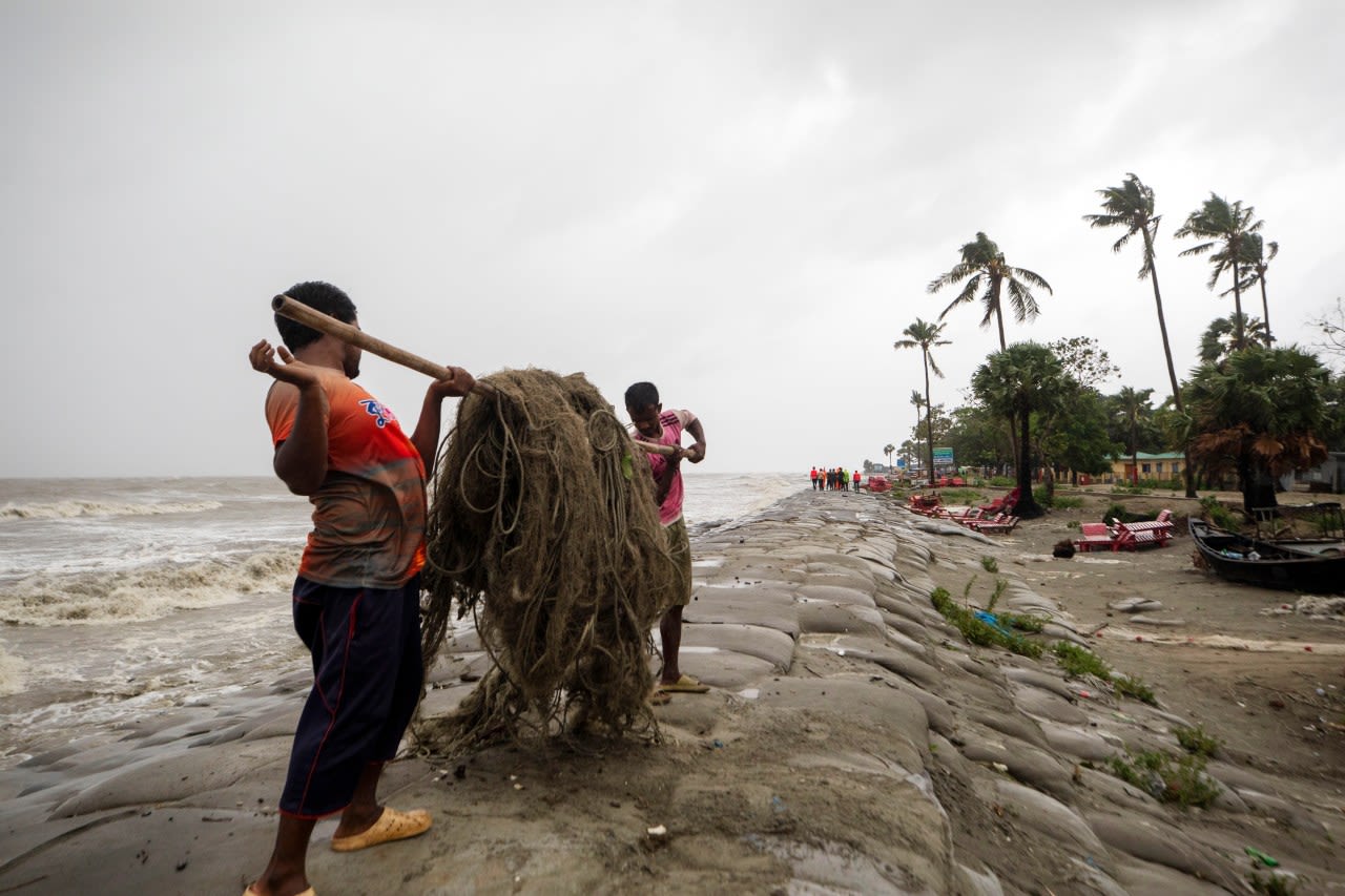 Cyclone floods coastal villages and cuts power in Bangladesh, where 800,000 had evacuated