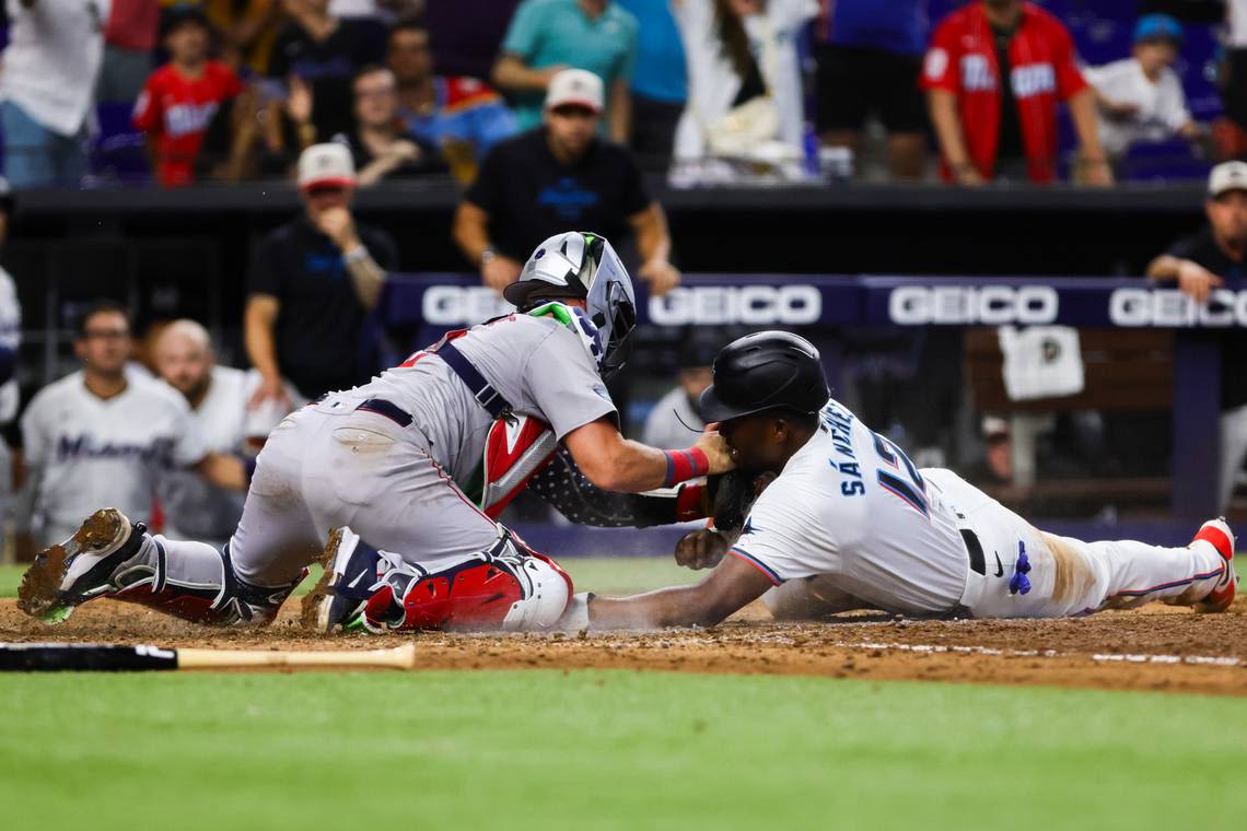 Marlins break up no-hitter in seventh, rally to force extras, still get swept by Red Sox