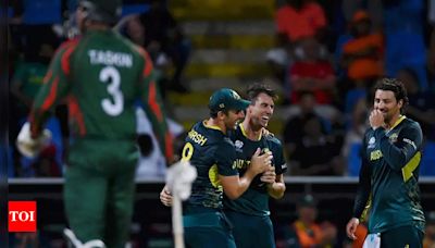 T20 World Cup: Pat Cummins' hat-trick, David Warner's fifty star in Australia's win over Bangladesh in rain-hit Antigua | Cricket News - Times of India