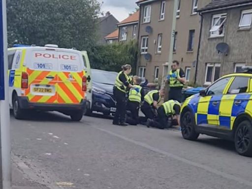 Police descend on Dundee street over 'disturbance involving knife'