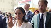 Meghan changes into chic white suit as she and Harry visit army wives in Nigeria