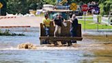 Heat persists across the US as floods swamp Midwest