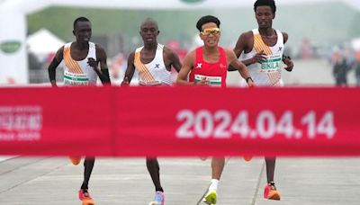 Chinese runner’s win invites suspicion after rivals appear to step aside | CNN