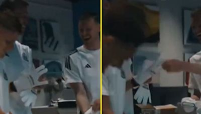 Dan Burn awkwardly tries on and goalkeeper gloves and has teammates in stitches