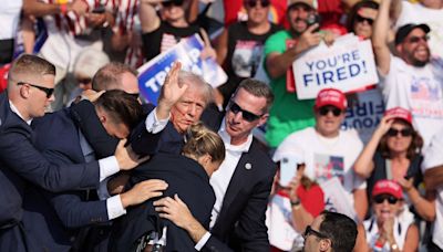 Trump's campaign website redirects to fundraising site featuring bloody fist pump photo