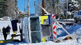 Rural Metro fire engine lands on its side after snowy road gives way