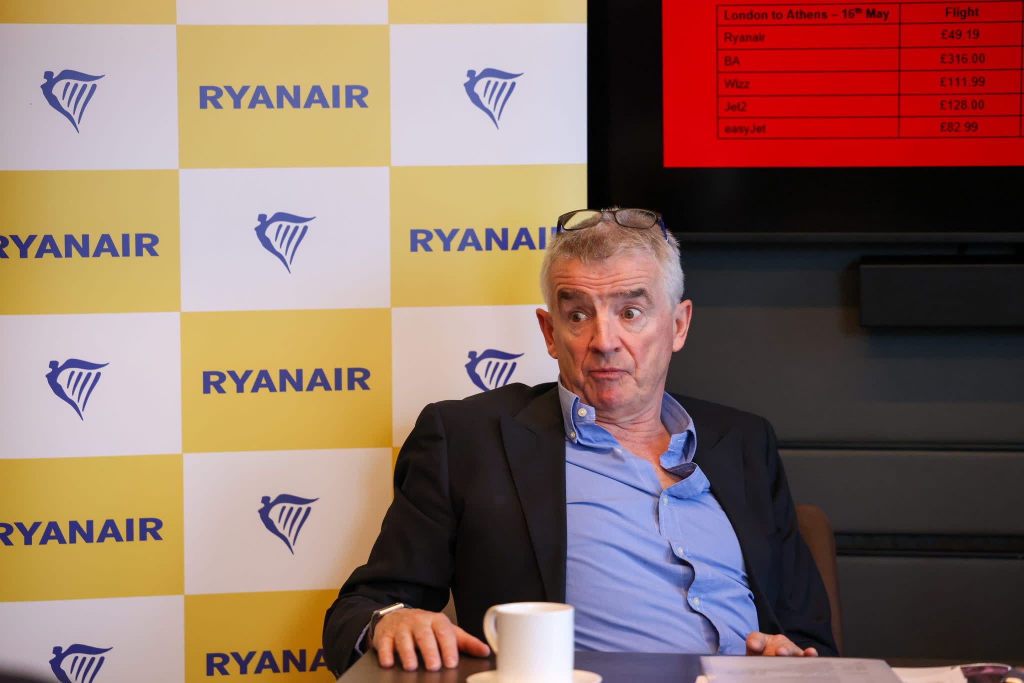 Ryanair profits nearly halved as the low-cost airline blames its ‘frugal’ customers for booking too many last-minute tickets