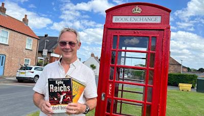 Village phone box converted into book exchange