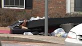 Mother and daughter upset when their belongings are thrown onto the curb after an apartment fire