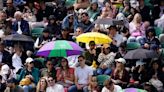 Heavy downpours suspend play on outdoor courts at Wimbledon