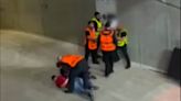 Shocking moment fan is PUNCHED and KICKED by stewards