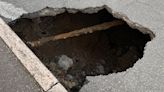 Huge 10ft wide sinkhole in middle of town ignites safety fears