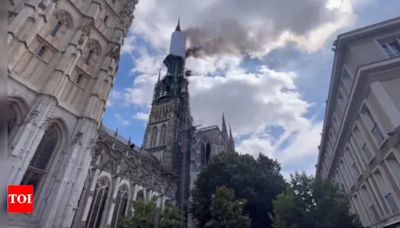Watch: Fire engulfs spire of Iconic gothic cathedral in France - Times of India