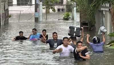 Typhoon killed 13 in Philippines, where people plead for rescue; storm kills 3 as it nears Taiwan