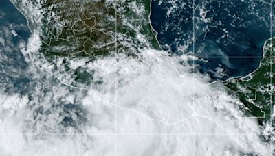 2 dead as hurricane John makes landfall on Mexico's Pacific coast, now degrades to a tropical storm