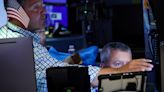 Wall St ends volatile session lower in aftermath of global tech outage