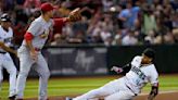 Carroll's 2-run triple in the 8th rallies Diamondbacks past Cardinals 3-1 to snap a 5-game skid