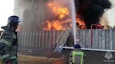 Fire at drone-hit Russian oil depot rages for second day, emergency services say